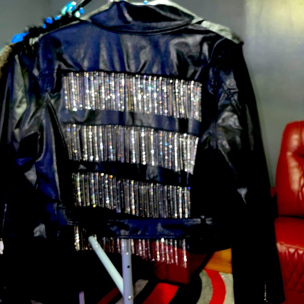 Fashionable black, biker jacket, silver singles on the back